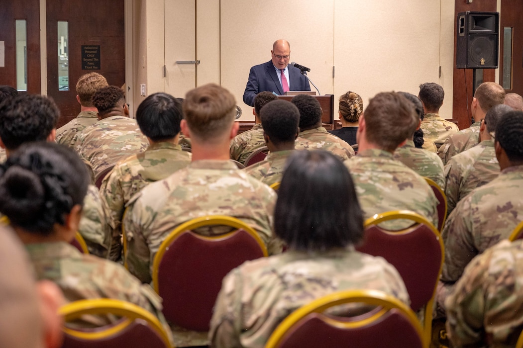 Airmen listen to a speaker at Travis AFB.