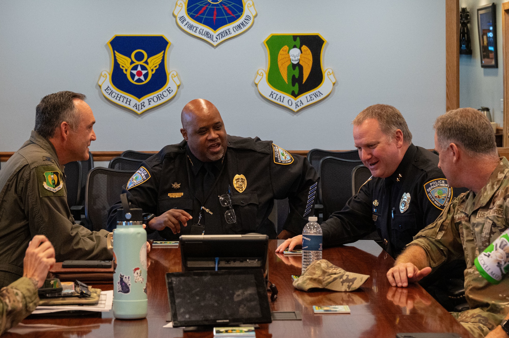 U.S. Air Force Col. James Schlabach, 91st Missile Wing commander, Michael Frye, Minot Police Department chief of police, Captain Dale Plessas, Minot Police Department deputy chief and U.S. Air Force Col. Jesse Lamarand, 5th Bomb Wing commander at Minot Air Force Base, North Dakota, Sept. 29, 2025 The engagement included a tour of facilities and discussions aimed at supporting cooperation between the base and the local community. (U.S. Air Force photo by Airman 1st Class Vincent Padilla)