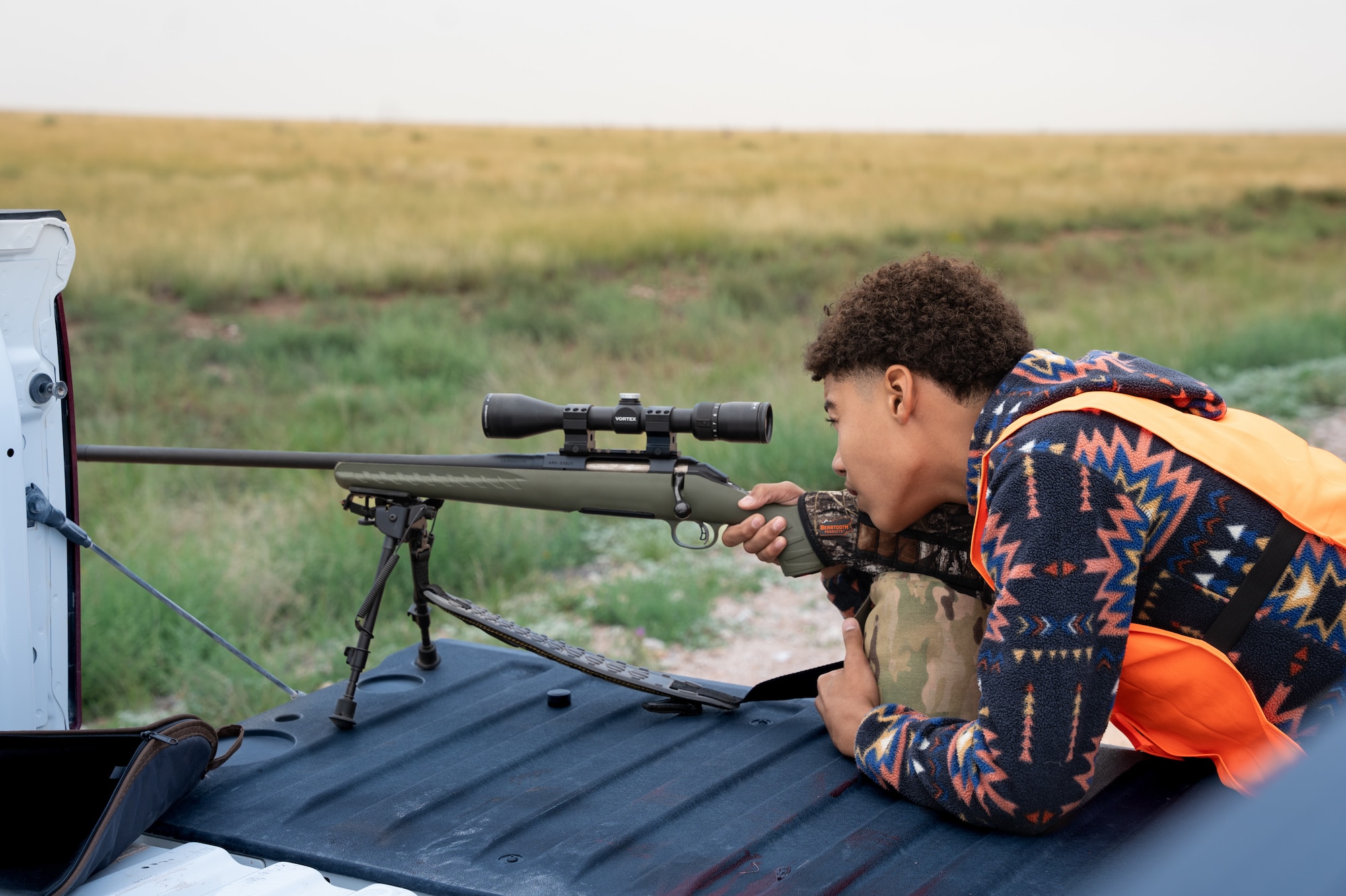 A youth hunter looks through the scope of a rifle during a hunt at Melrose Air Force Range, New Mexico, Sept. 6, 2025. The Steadfast Line hosted the Pronghorn Population Management Program, which is open to New Mexico youth between 12 and 17 years old through the New Mexico Department of Game and Fish lottery system. (U.S. Air Force photo by Senior Airman Sarah Gottschling)