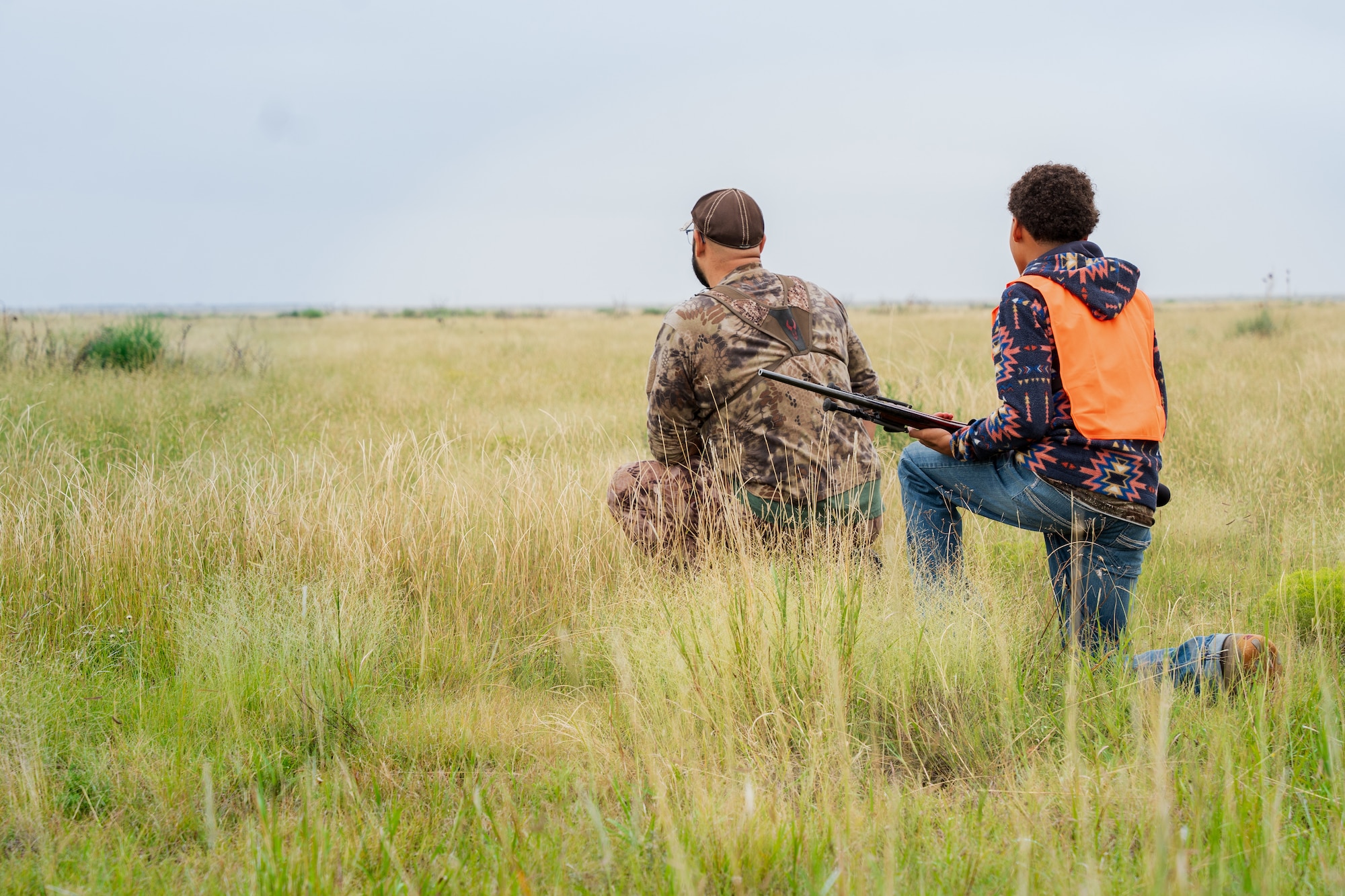 A huntsman guide and youth hunter stalk a pronghorn in the distance during a hunt at Melrose Air Force Range, New Mexico, Sept. 6, 2025. MAFR has hosted the Pronghorn Population Management Hunt program for five years, which prevents hazards on the range. (U.S. Air Force photo by Senior Airman Sarah Gottschling)