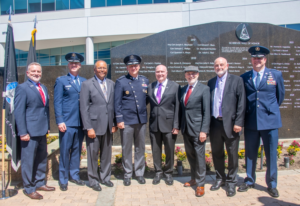 (Left to Right) U.S. Air Force Col. (Ret.)  Scott W. Beidelman, chapter president of the Air and Space Forces Association (AFA) Schriever Chapter 147, U.S. Space Force Col. Andrew S. Menschner, deputy commander, Space Systems Command, U.S. Air Force Lt. Gen. (Ret.) Samuel A. Greaves, U.S. Space Force Gen. Michael A. Guetlein, direct reporting program manager, Golden Dome for America, U.S. Air Force Maj. Gen. (Ret.) Thomas D. Taverney, U.S. Air Force Col. (Ret.) Mr. Douglas L. Loverro, U.S. Air Force Col (Ret.) Mr. David W. Madden, U.S. Space  Force Col. Andrew C. Dermanoski, commander, Space Base Delta 3, gather in front of the Gen. Bernard Schriever Memorial Wall of Honor, Sept. 4, 2025, at Los Angeles Air Force Base (LA AFB) in El Segundo, California. Each year, Space Systems Command inscribes the names of six military space pioneers into the Schriever Wall of Honor during a ceremony held at Space Systems Command’s headquarters at LA AFB. This year’s honorees include Greaves, U.S. Air Force Col. (Ret.) Jack L. Hyslop, Dr. Donald N. Jortner, Loverro, Madden, and Taverney.