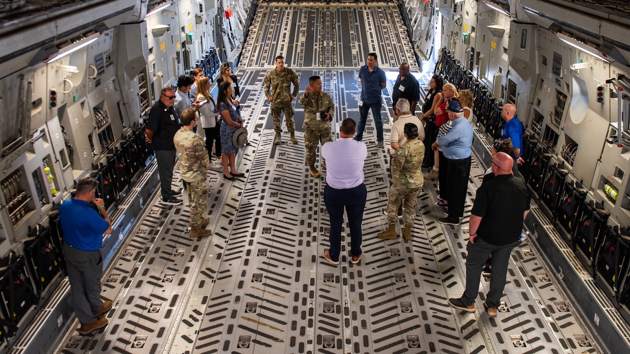 Airman gives tour of aircraft to honorary commanders