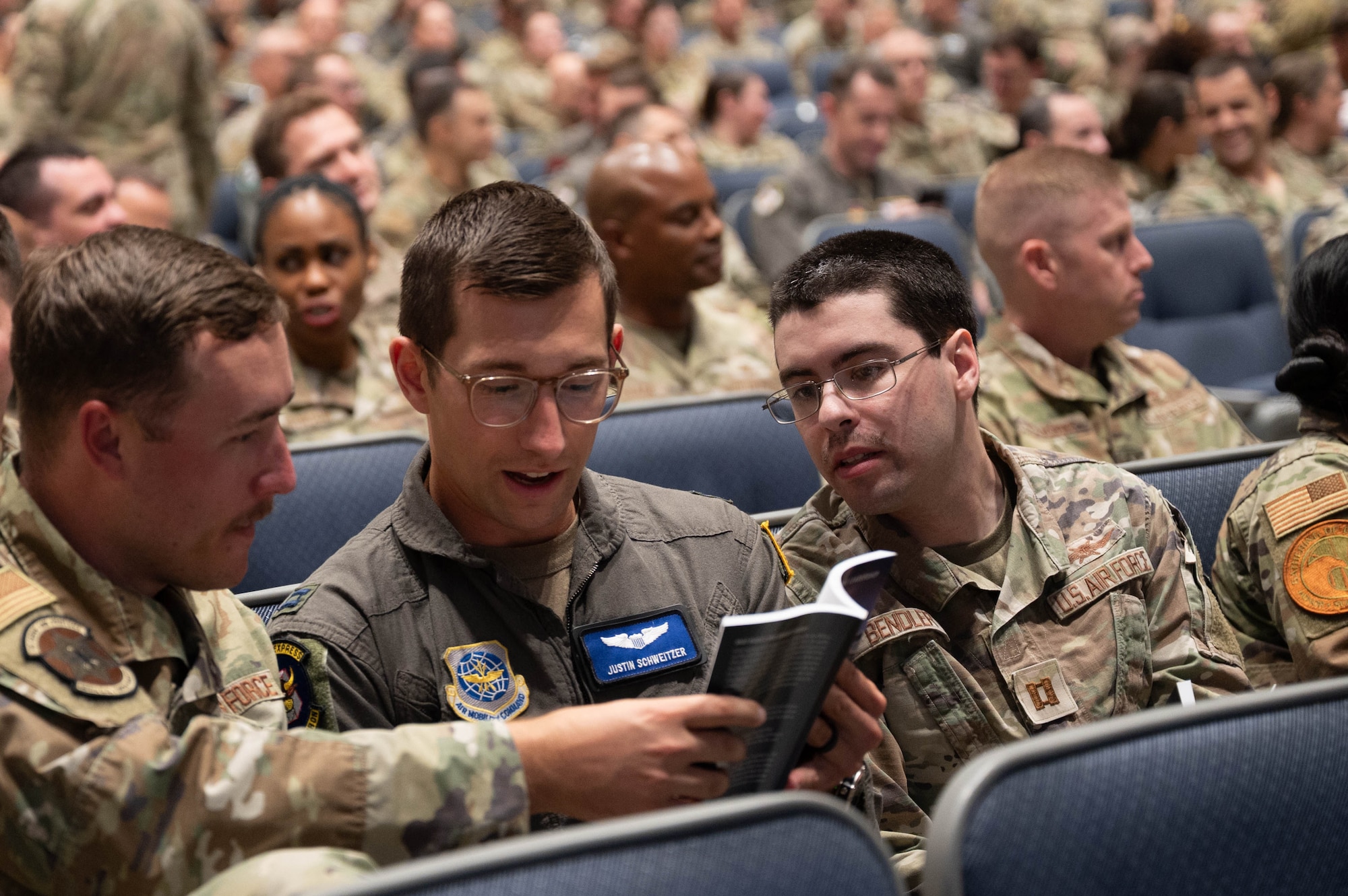 U.S. Airmen discuss the book “Get Back Up: Lessons in Servant Leadership”, while attending a fireside chat at the Squadron Officer School on Maxwell Air Force Base, Alabama, Sept. 29, 2025.