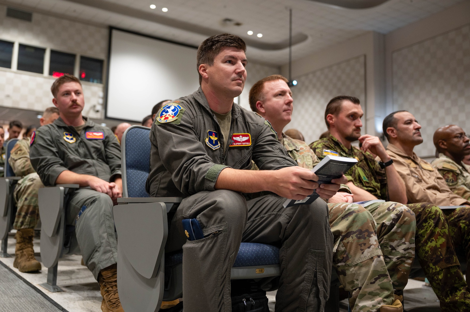 Base personnel listen to retired Gen. David Goldfein, former Air Force Chief of Staff, and former Secretary of the Air Force Heather Wilson speak during a fireside chat at the Squadron Officer School on Maxwell Air Force Base, Alabama, Sept. 29, 2025.