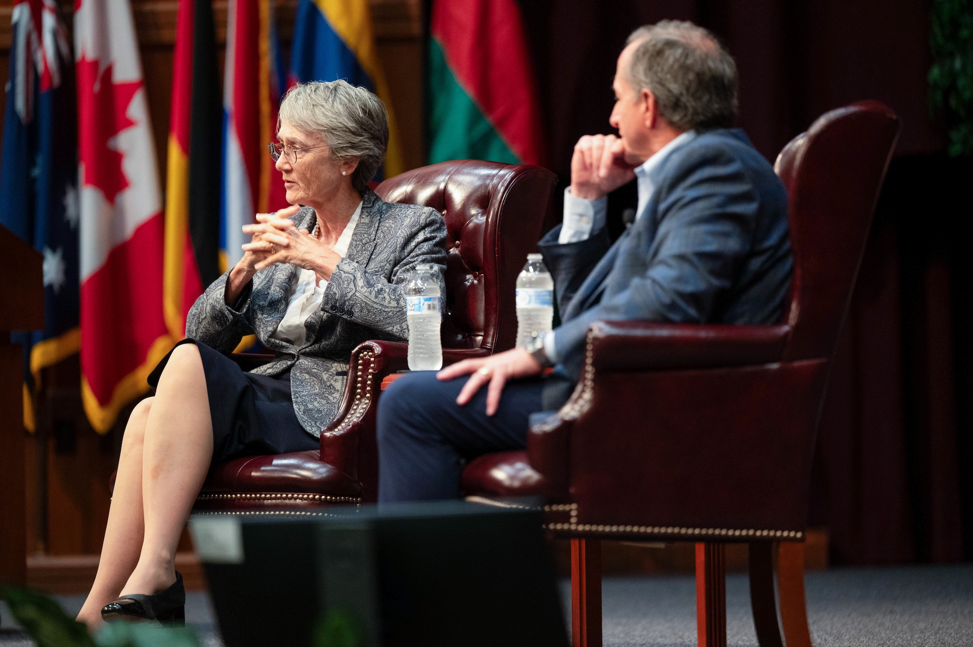 Former Secretary of the Air Force Heather Wilson and retired Gen. David Goldfein, former Air Force Chief of Staff, discuss their book during a Barnes Enlisted Education Center discussion in the Senior NCO Academy auditorium at Gunter Annex Air Force Base, Alabama, Sept. 30, 2025.