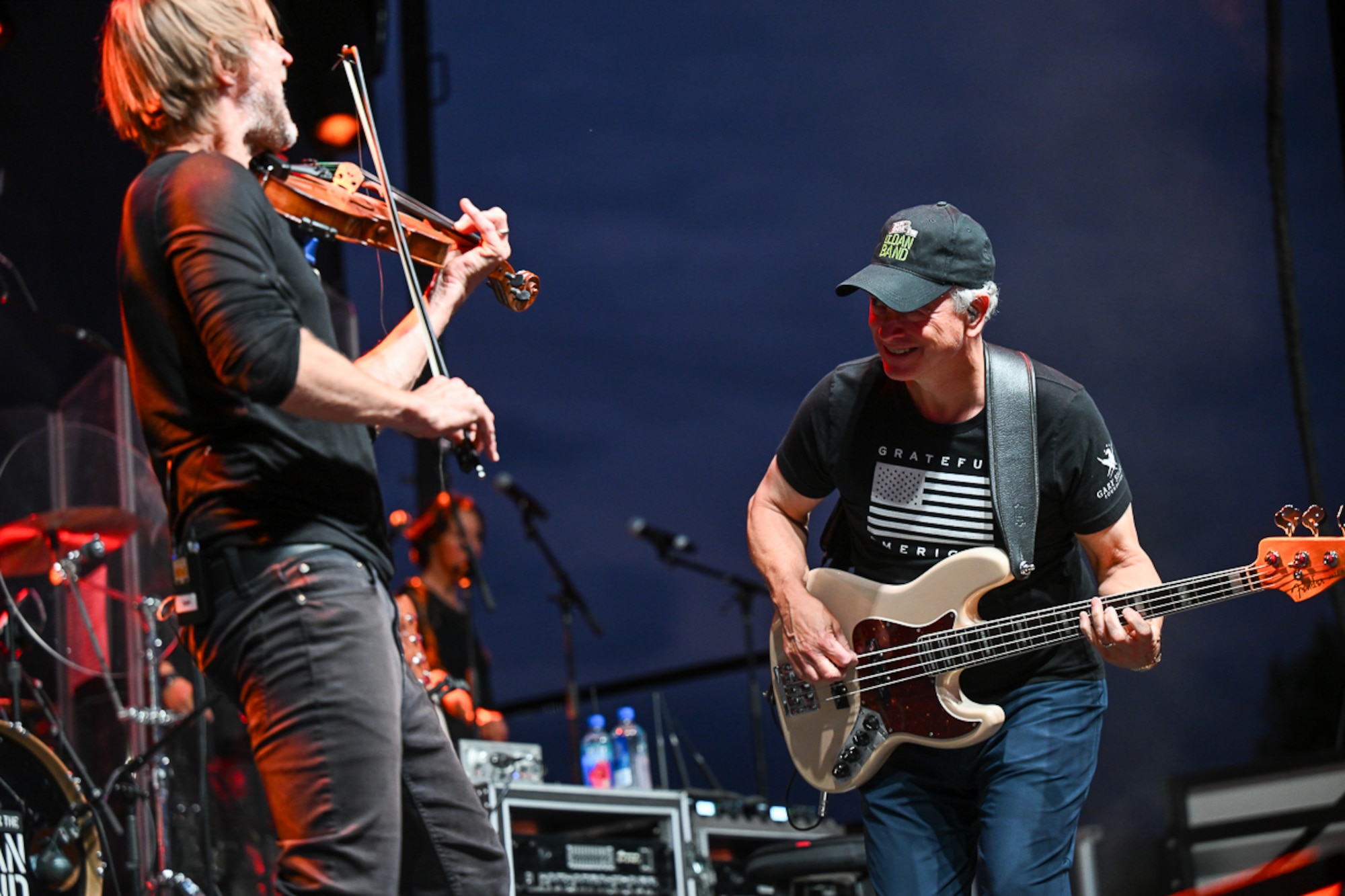 Violinist Dan Myers and bass guitarist Gary Sinise perform with the Lt. Dan Band