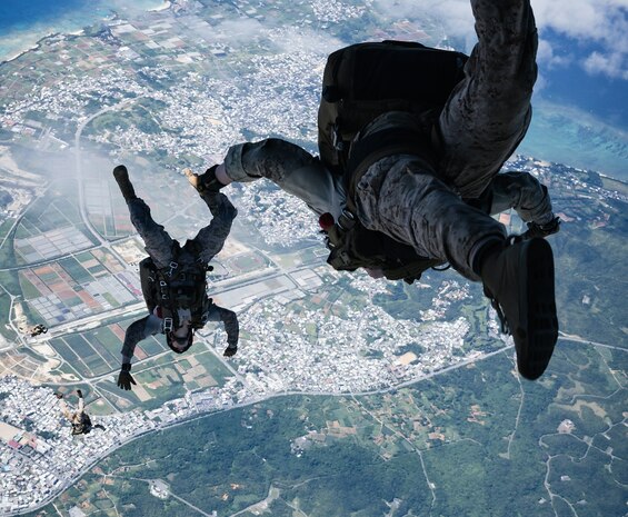 U.S. Marines with Force Reconnaissance Platoon, Maritime Raid Force, 31st Marine Expeditionary Unit, conduct a freefall jump during parachute operations training over Okinawa, Japan, Sep. 26, 2025.