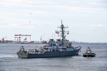 Sailors assigned to the Arleigh Burke-class guided-missile destroyer USS Benfold (DDG 65) man the rails as the ship departs Commander, Fleet Activities Yokosuka, Japan, Sept. 29, following 10 consecutive years of forward-deployed service in the U.S. 7th Fleet area of operations.