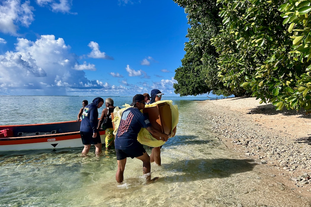 The crew of the USCGC Oliver Henry (WPC 1140) deliver essential supplies donated through a nonprofit foundation and coordinated with the U.S. Embassy in Kolonia to Sapwuahfik in the Federated States of Micronesia on Sept. 13, 2025.