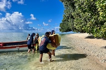 The crew of the USCGC Oliver Henry (WPC 1140) deliver essential supplies donated through a nonprofit foundation and coordinated with the U.S. Embassy in Kolonia to Sapwuahfik in the Federated States of Micronesia on Sept. 13, 2025.