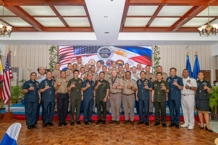Leaders and attendees from the Hawai‘i National Guard, Guam National Guard and Armed Forces of the Philippines gather for a group photo during the 25th anniversary celebration of the State Partnership Program between the Hawai‘i National Guard and the AFP at Clark Air Base, Philippines, Sept. 25, 2025.