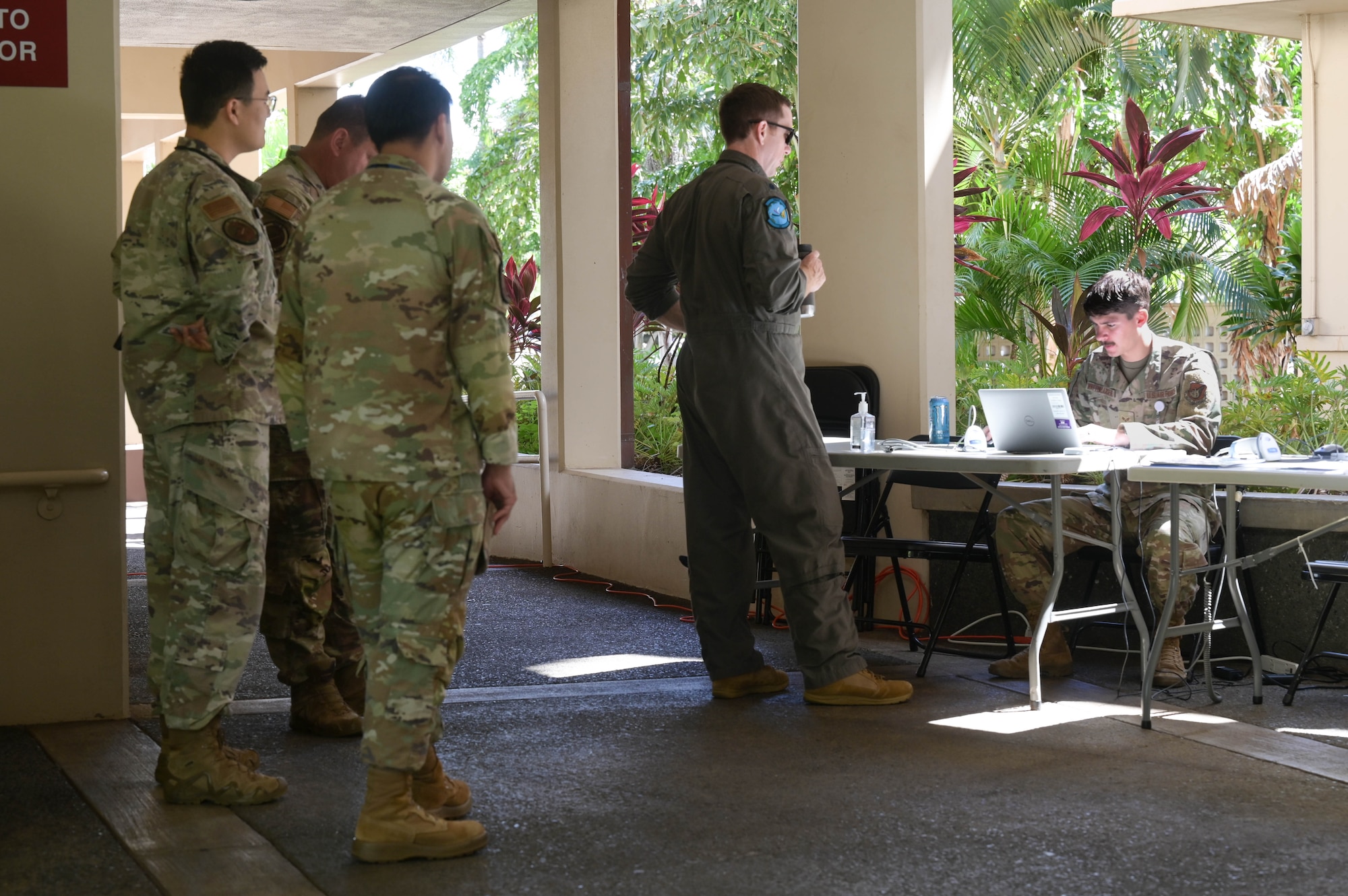 Airmen standing in line.