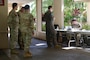 Airmen standing in line.