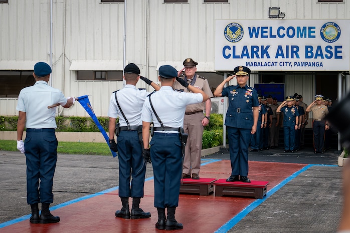 U.S. Army Maj. Gen. Stephen Logan, adjutant general of the State of Hawai‘i, and Armed Forces of the Philippines Air Force Brig. Gen. Jose Bonafacio, 410 Maintenance Wing commander, render honors during a pass and review at Clark Air Base, Mabalacat City, Pampanga, Philippines, Sept. 25, 2025.