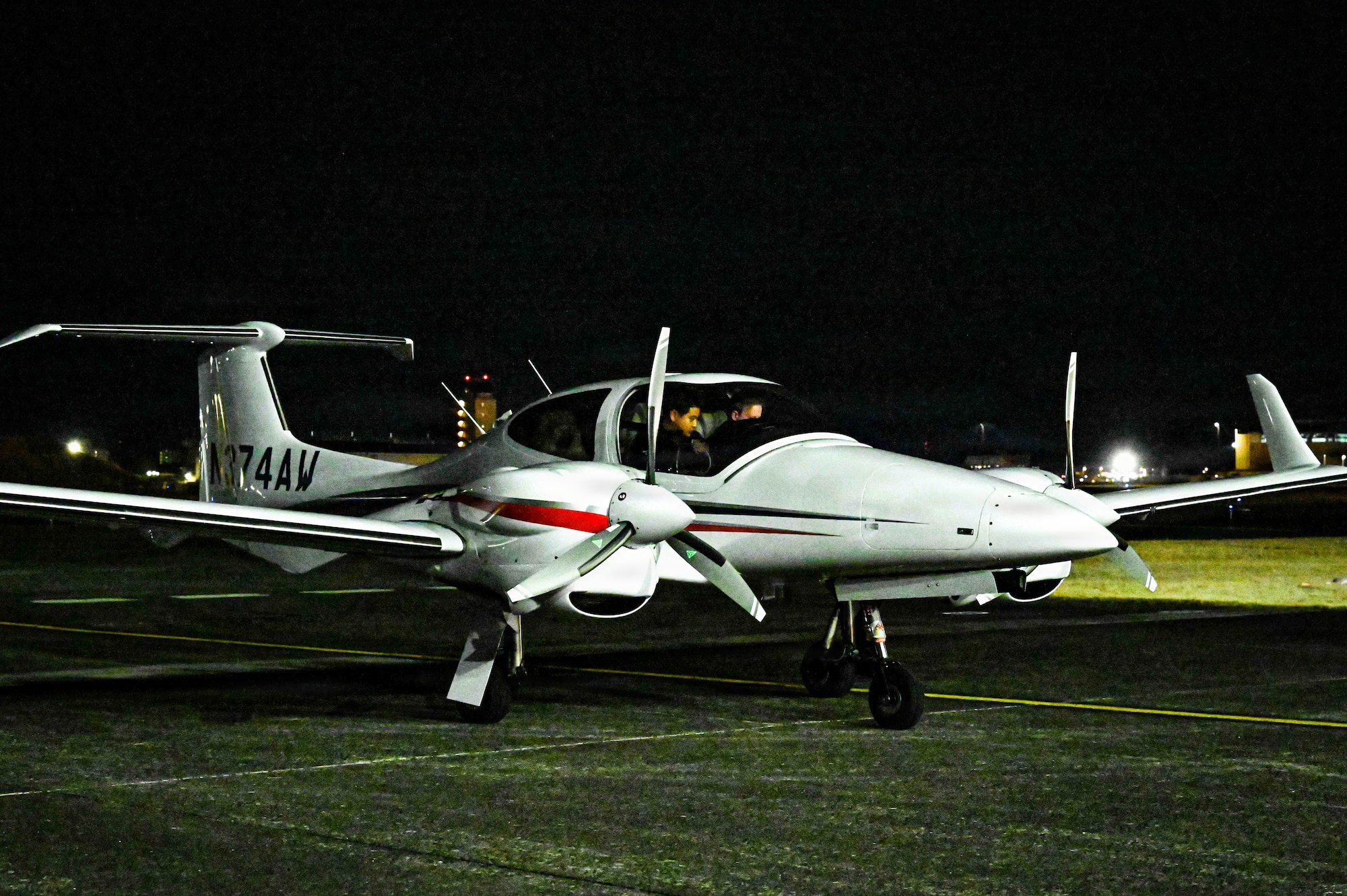A Diamond DA42 NG Twin Star assigned to the Yokota Flight Center lands during a small parts delivery mission as part of exercise Beverly Midnight 2026 at Yokota Air Base, Japan, March 13, 2026. This exercise provides unique opportunities to synchronize and integrate various forces across Japan into joint, coalition and bilateral training from simulated forward operating bases.
