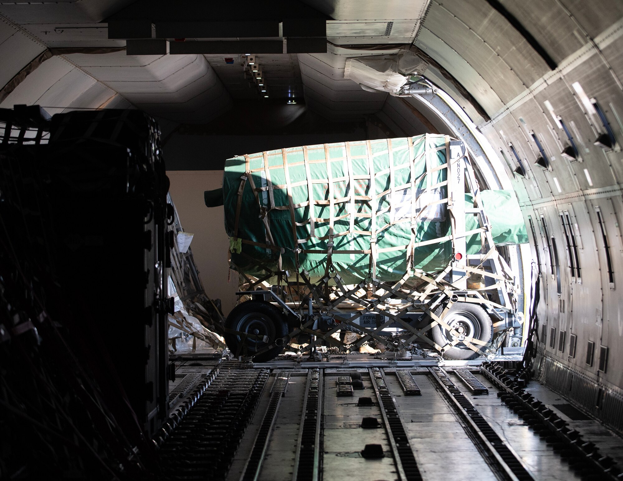 U.S. Air Force Airmen from the 133rd Air Transportation Function load cargo onto a Boeing 747 transport aircraft in St. Paul, Minn., Feb. 26, 2026.