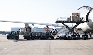 U.S. Air Force Airmen from the 133rd Air Transportation Function load cargo onto a Boeing 747 transport aircraft in St. Paul, Minn., Feb. 26, 2026.
