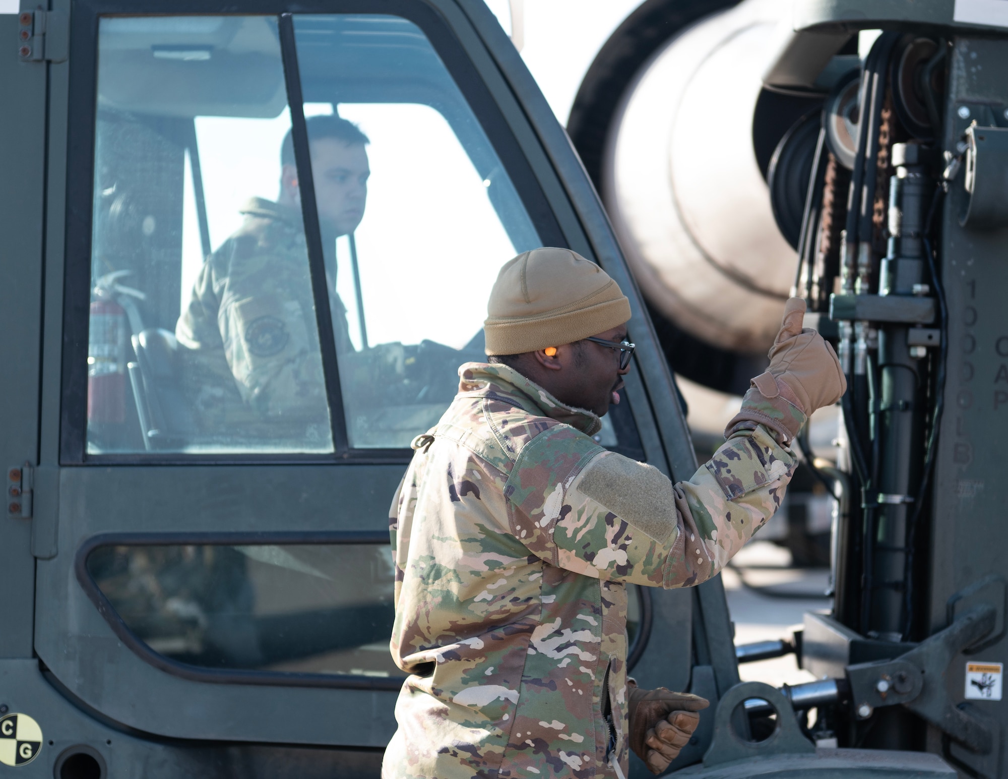 U.S. Air Force Airmen from the 133rd Air Transportation Function load cargo onto a Boeing 747 transport aircraft in St. Paul, Minn., Feb. 26, 2026.