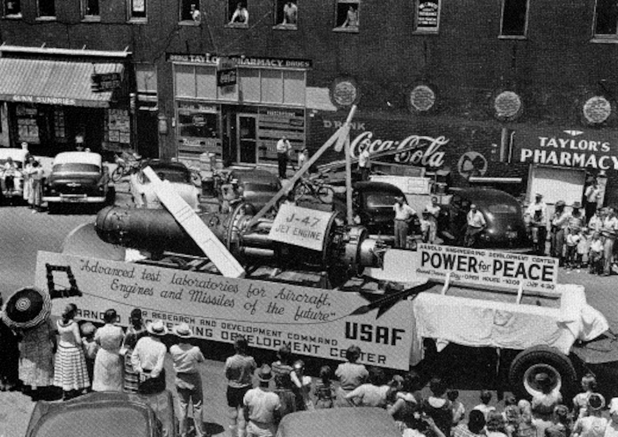 The Arnold Engineering Development Center float is featured in an early 1950s Armed Forces Day Parade in Tullahoma, Tenn. The float included a J47 turbojet engine, the first engine tested at AEDC. The Center in Tennessee would later become the headquarters of Arnold Engineering Development Complex. (U.S. Air Force photo)