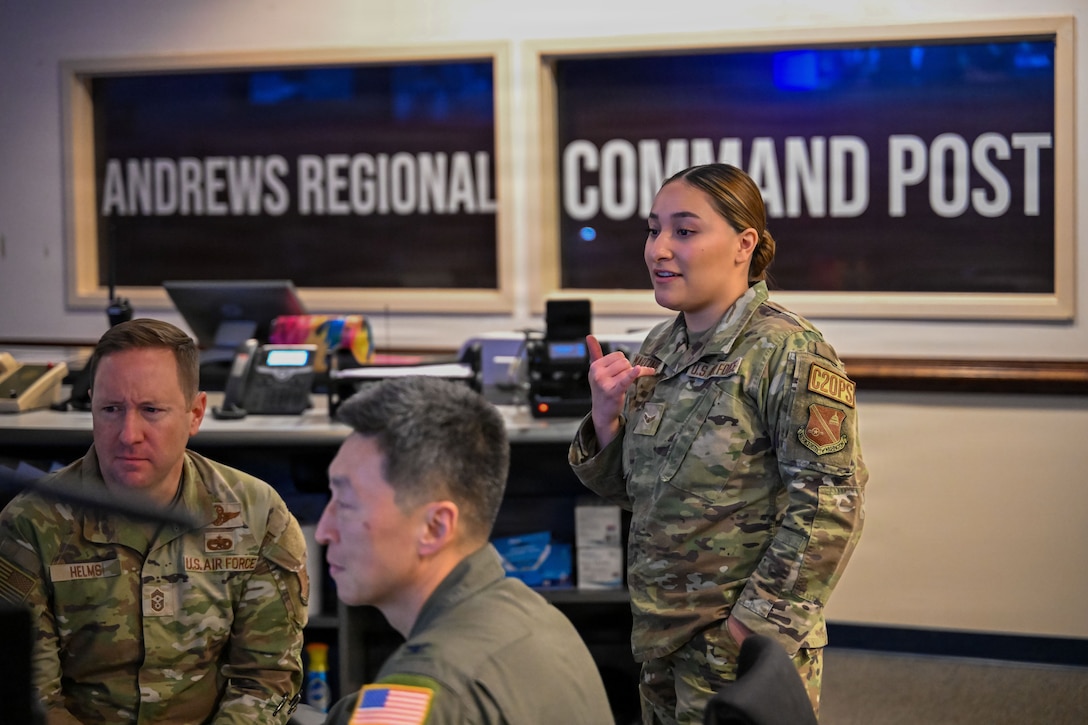 U.S. Air Force Airman 1st Class Natalie Martinez give base leadership a walk through on daily operations.