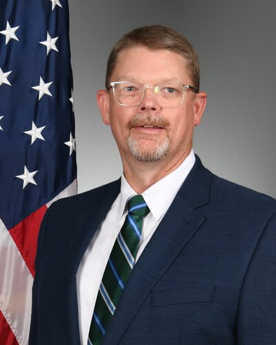 Man posing for official photo