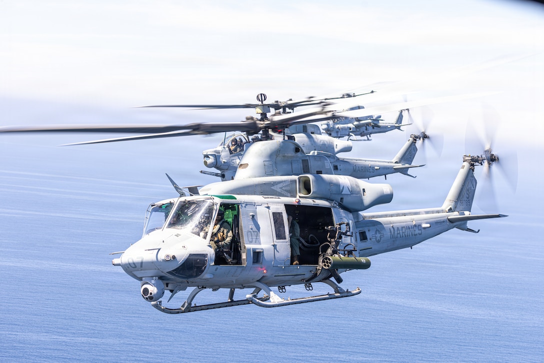 U.S. Marine Corps UH-1Y Venom and AH-1Z Viper helicopters assigned to Marine Light Attack Helicopter Squadron (HMLA) 169, Marine Aircraft Group 39, 3rd Marine Aircraft Wing, perform a mixed-section flyover for the San Diego Padres 2026 Season Opening Day Game at Petco Park, San Diego.