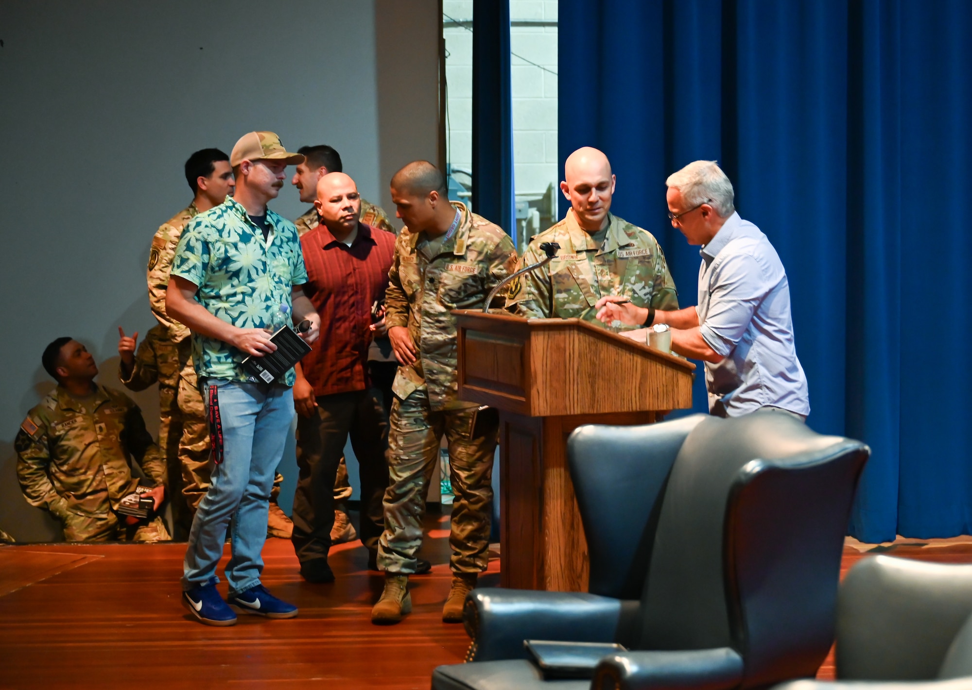 People line up to talk to a guest speaker