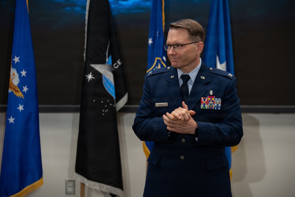Col. Dale Harrell, incoming 711th Human Performance Wing commander, acknowledges the audience’s applause during a change of command ceremony at Wright-Patterson Air Force Base, Ohio, March 30, 2026.
