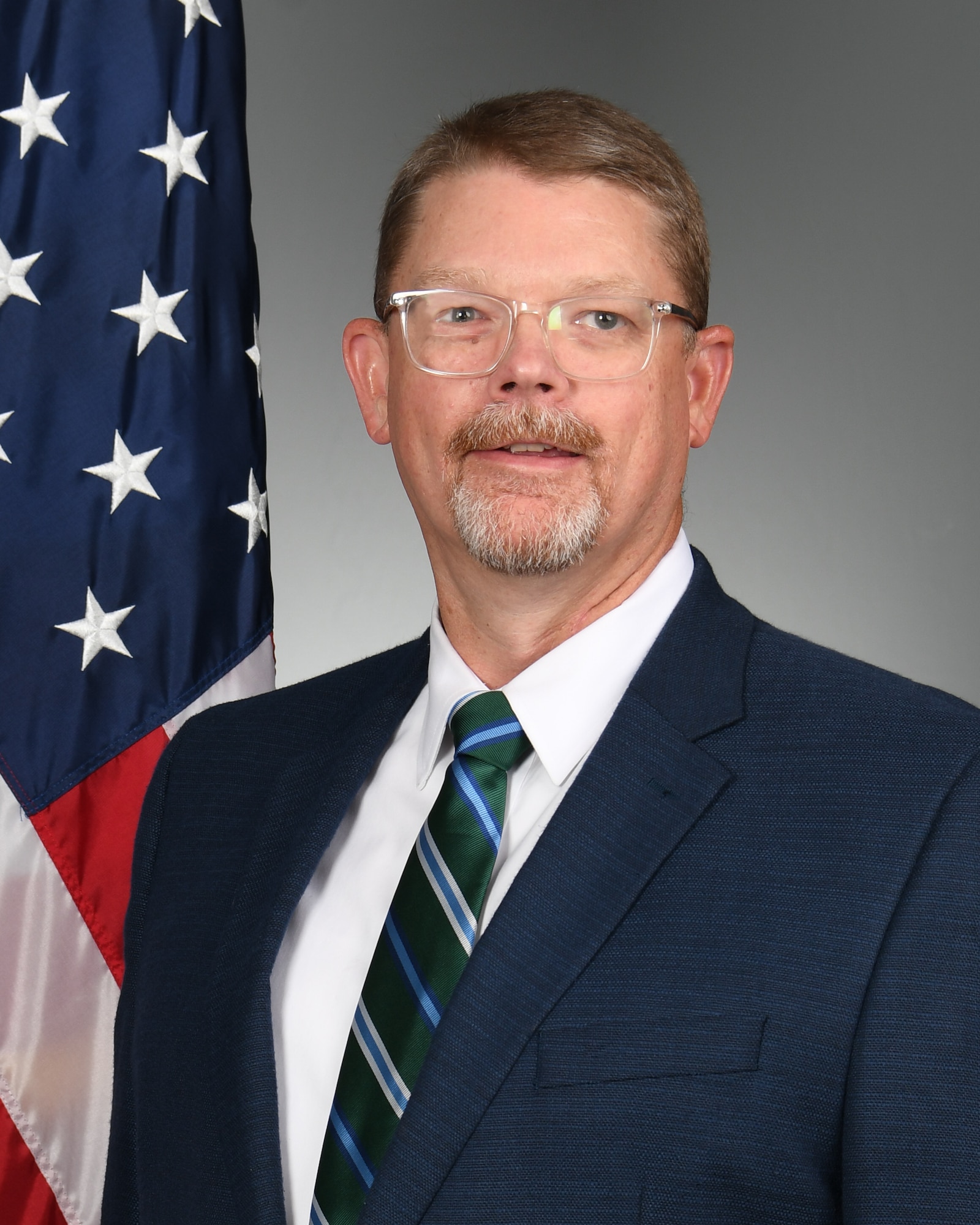 Man posing for official photo