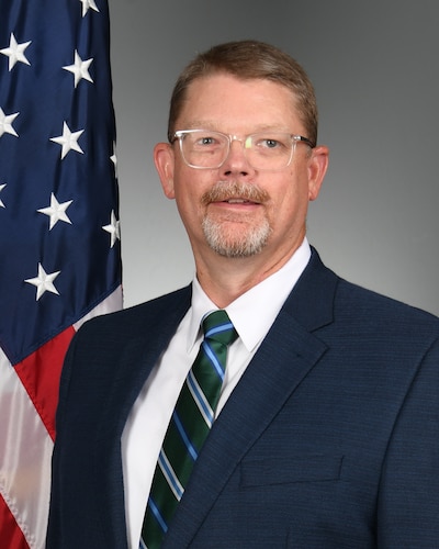 Man posing for official photo