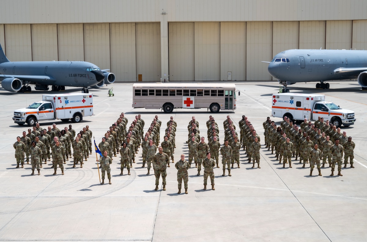Image of Airmen in formation, posing for a photo.