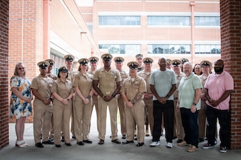 Current and former Navy Chief Petty Officers stand for a photo Wednesday, April 1, 2026 at Naval Health Clinic Cherry Point.  Sailors and civilians aboard the clinic celebrated the 133rd birthday of the Chief Petty Officer earlier with  the reading of the Chief of Naval Operations Admiral Daryl Caudle’s “C-Note” before the cutting and serving of a ceremonial cake.