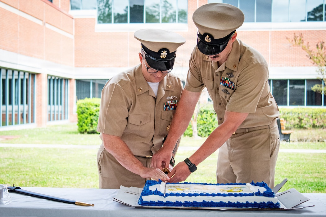 Command Master Chief Corey Butler, left, and Chief Petty Officer Tyler Goodrich, cut a ceremonial cake at Marine Corps Air Station Cherry Point, North Carolina, Wednesday, April 1, 2026. The ceremony honored the 133rd birthday of the U.S. Navy Chief Petty Officer, a rank established in 1893 to serve as technical experts, leaders, and mentors.