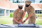 Command Master Chief Corey Butler, left, and Chief Petty Officer Tyler Goodrich, cut a ceremonial cake at Marine Corps Air Station Cherry Point, North Carolina, Wednesday, April 1, 2026. The ceremony honored the 133rd birthday of the U.S. Navy Chief Petty Officer, a rank established in 1893 to serve as technical experts, leaders, and mentors.
