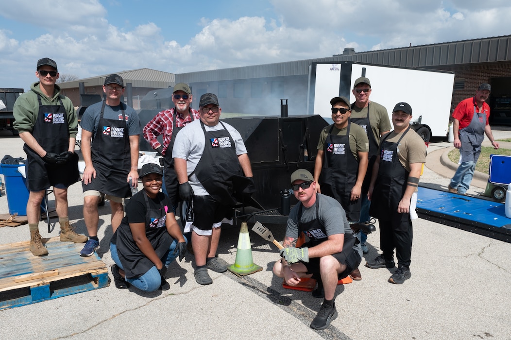 Volunteers from across the base, including Airmen and civilians, pose for a picture at the Louis F. Garland Fire Academy, Goodfellow AFB, Texas, March 6, 2026. The volunteers arrived first thing in the morning to cook for the Breaking Bread with Heroes Luncheon event.