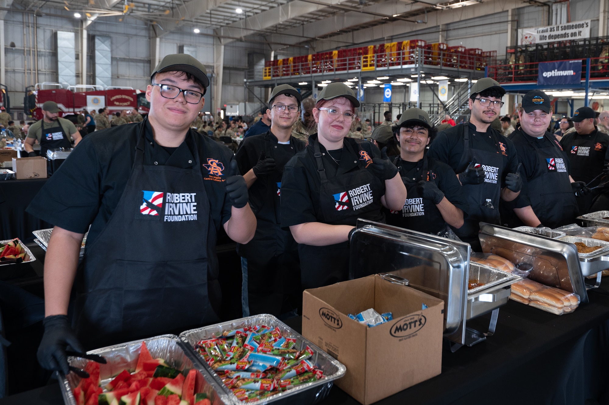 Students from the Culinary Arts Program in San Angelo Central High School, pose for a picture at the Louis F. Garland Fire Academy, Goodfellow AFB, Texas, March 6, 2026. The students served service members and their families during a Breaking Bread with Heroes Luncheon.