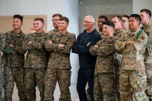 Chef Robert Irvine, a celebrity culinary chef, poses for a photo with students at the Louis F. Garland Fire Academy, Goodfellow AFB, Texas, March 6, 2026. Irvine’s foundation provided a Breaking Bread with Heroes Luncheon for the students.