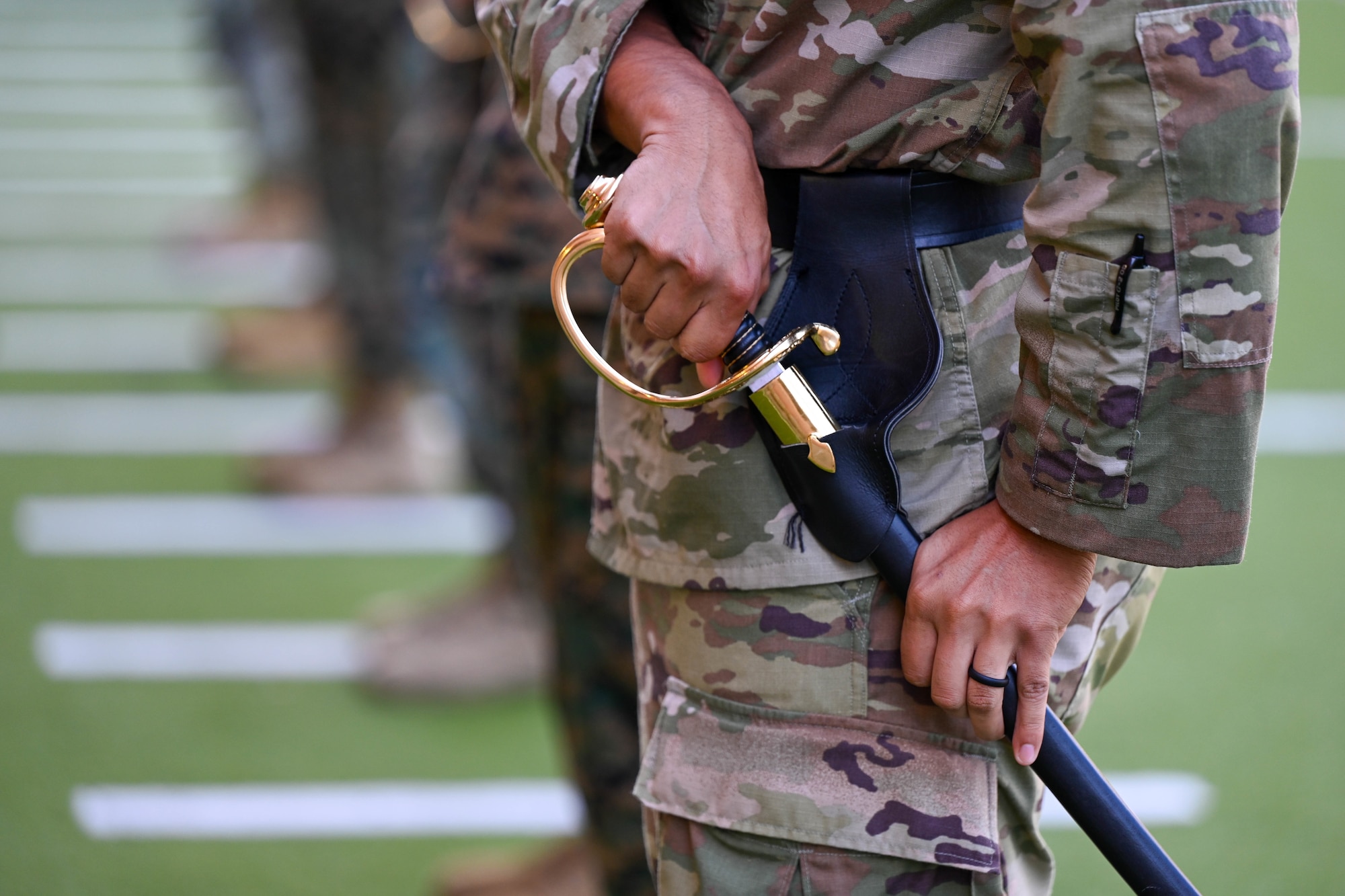 A U.S. Air Force security forces Airman assigned to the 1st Special Operations Wing participates in a sword and guidon lesson during Marine Corps Corporal Course Class 1-26, at Naval Air Station Pensacola, Florida, Feb. 17, 2026.