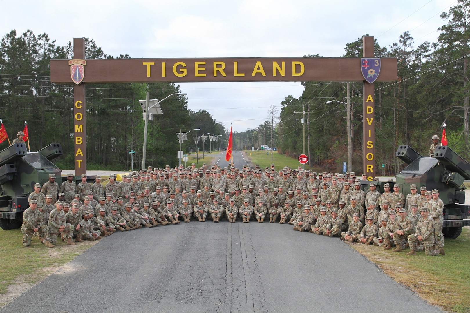 Soldiers of the 3rd Battalion, 265th Air Defense Artillery Regiment pose for a unit photo outside of the "Tigerland" sign at the Joint Readiness Training Center at Fort Polk, Louisiana, on March 22, 2026.