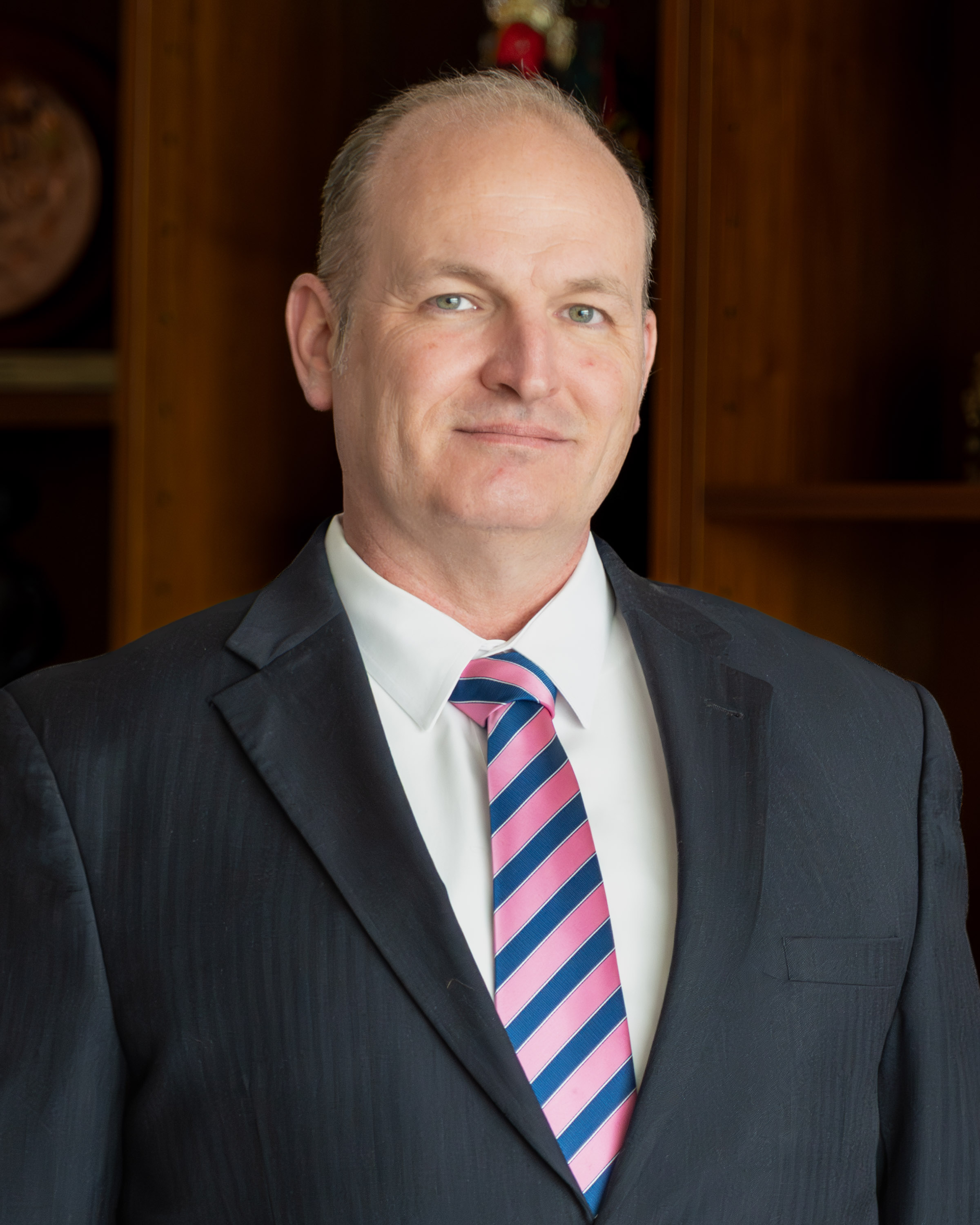 Headshot of COL Brian J. Henderson, International Fellows Program Director, against a neutral background.