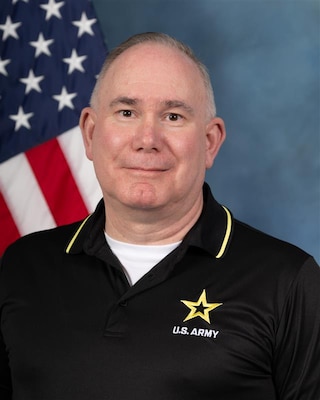 Headshot of Tim Keasling, USAWC staff, smiling against a neutral background.