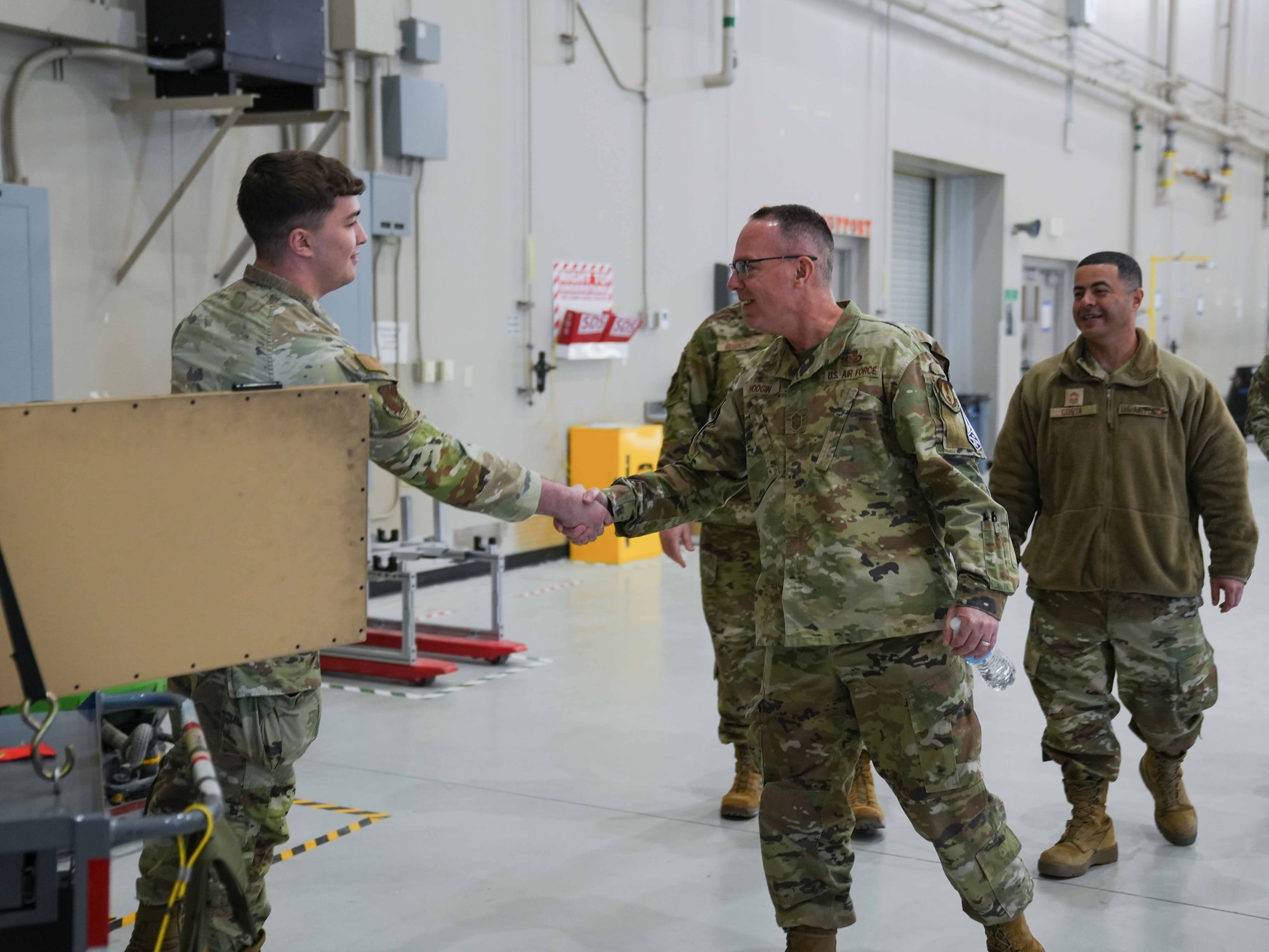 U.S. Air Force  Chief Master Sgt. Timothey Hodgin, Air Force Research Laboratory command chief, meets an Airman assigned to the 25th Aircraft Maintenance Squadron at Creech Air Force Base, Nevada, Jan. 9, 2026.