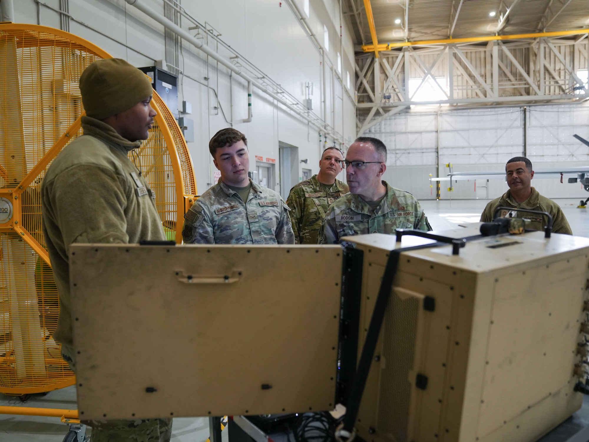 U.S. Air Force Chief Master Sgt. Timothey Hodgin, Air Force Research Laboratory command chief, discusses capabilities of a Portable Aircraft Control Station with Airmen assigned to the 25th Aircraft Maintenance Squadron at Creech Air Force Base, Nevada, Jan. 9, 2026.