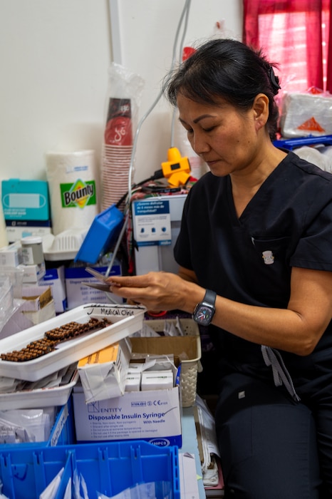 U.S. Air Force Lt. Col. Hiep Tran, 349th Medical Squadron pharmacist, prepares medication for patients at the West Demerara Regional Hospital in Vreed en Hoop, Guyana, March 19, 2026. U.S. Air Force medical personnel provided pharmacy support during the Lesser Antilles Medical Assistance Team 2026 mission, ensuring safe medication distribution while enhancing readiness and strengthening partnerships with Guyana Ministry of Health providers. (U.S. Air Force photo by Maj. Stephani Schafer)