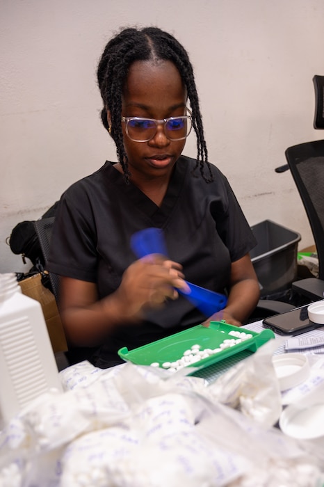 Ashley Abrams, a Guyanese pharmacy technician, counts pills for distribution to patients at the West Demerara Regional Hospital outpatient pharmacy in Vreed en Hoop, Guyana, March 19, 2026. U.S. Air Force medical personnel supported Guyanese pharmacy operations during LAMAT 2026, streamlining medication processing and dispensing while strengthening clinical readiness and collaboration with host nation providers.
(U.S. Air Force photo by Maj. Stephani Schafer)