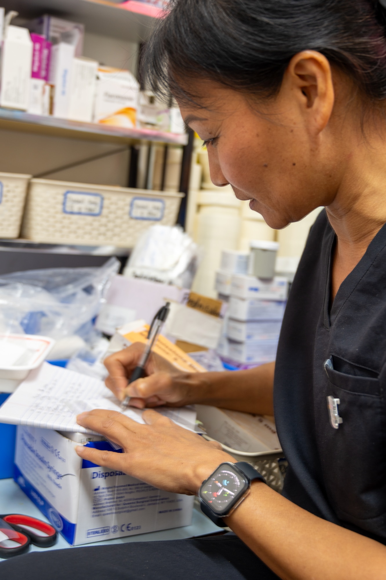 U.S. Air Force Lt. Col. Hiep Tran, 349th Medical Squadron pharmacist, prepares medication for patients at the West Demerara Regional Hospital in Vreed en Hoop, Guyana, March 19, 2026, during the Lesser Antilles Medical Assistance Team (LAMAT) health security cooperation. The LAMAT exchanges stand as a symbol of partnership through medical readiness, offering real-world benefits to achieve positive outcomes through collaboration with partner nations. (U.S. Air Force photo by Maj. Stephani Schafer)