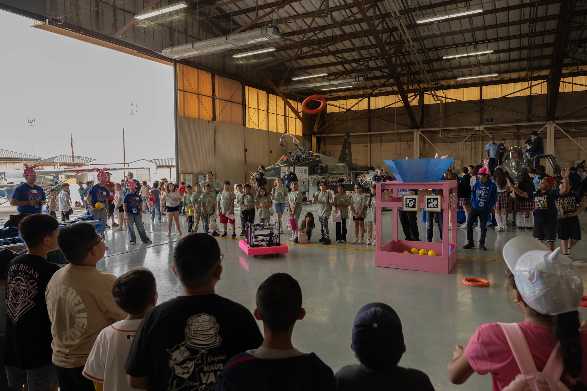 Team 4063 TriKzR4Kidz, a FIRST Robotics Competition team, performs a robotics demonstration during the Fiesta of Flight STEM Expo at Laughlin Air Force Base, Texas, March 27, 2026. The event hosted numerous exhibitors within the Armed Forces and nearby local communities. (U.S. Air Force photo by Airman 1st Class Darryl Keith)