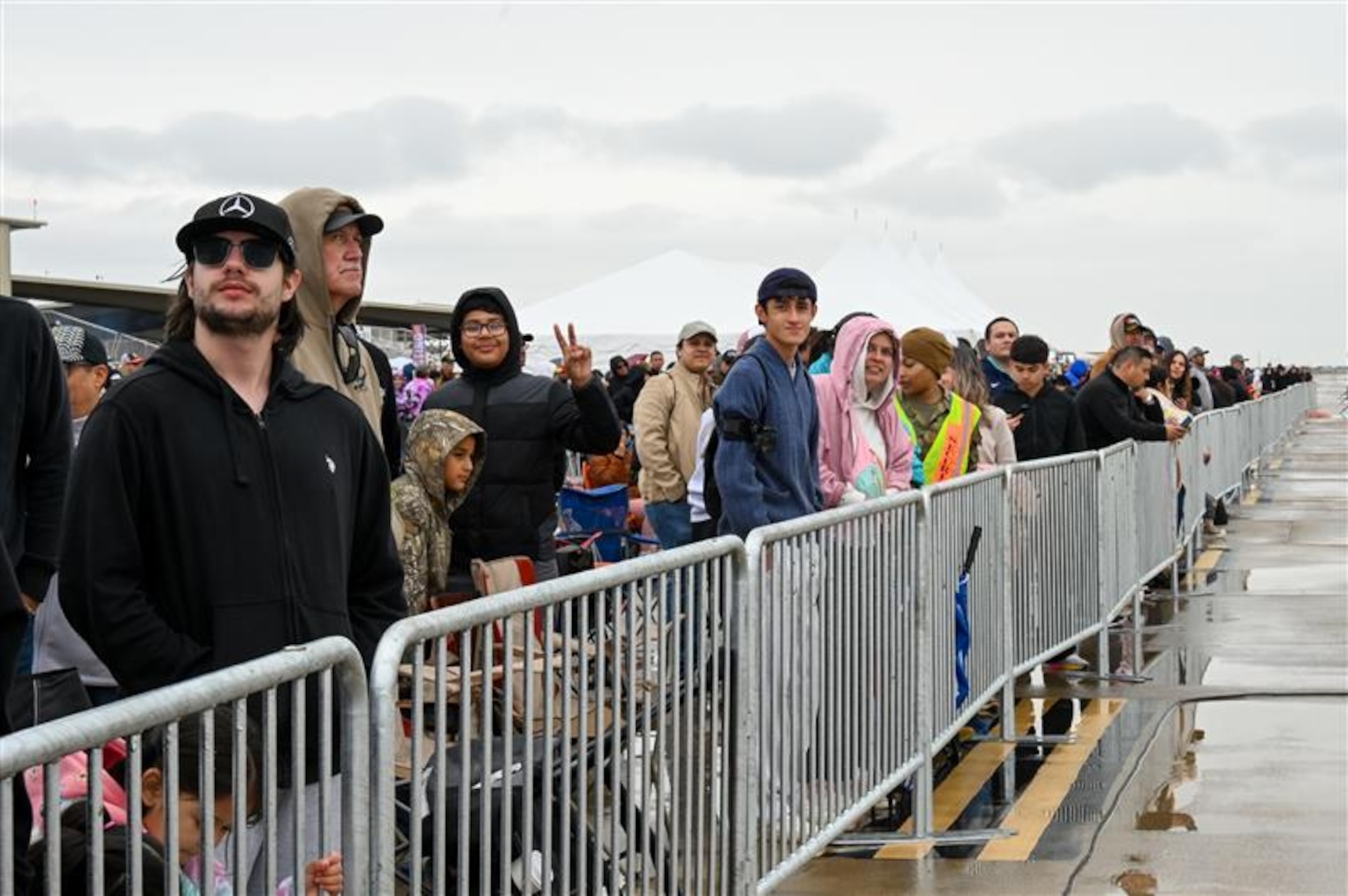 Attendees watch the ongoing performance during the Fiesta of Flight Airshow at Laughlin Air Force Base, Texas, March 28, 2026. The event showcased Team XL’s mission to develop mission-ready resilient airmen, leaders and families, and featured various aerial acts and static aircraft from across the country. (U.S. Air Force photo by Airman 1st Class Kylie Rabb)