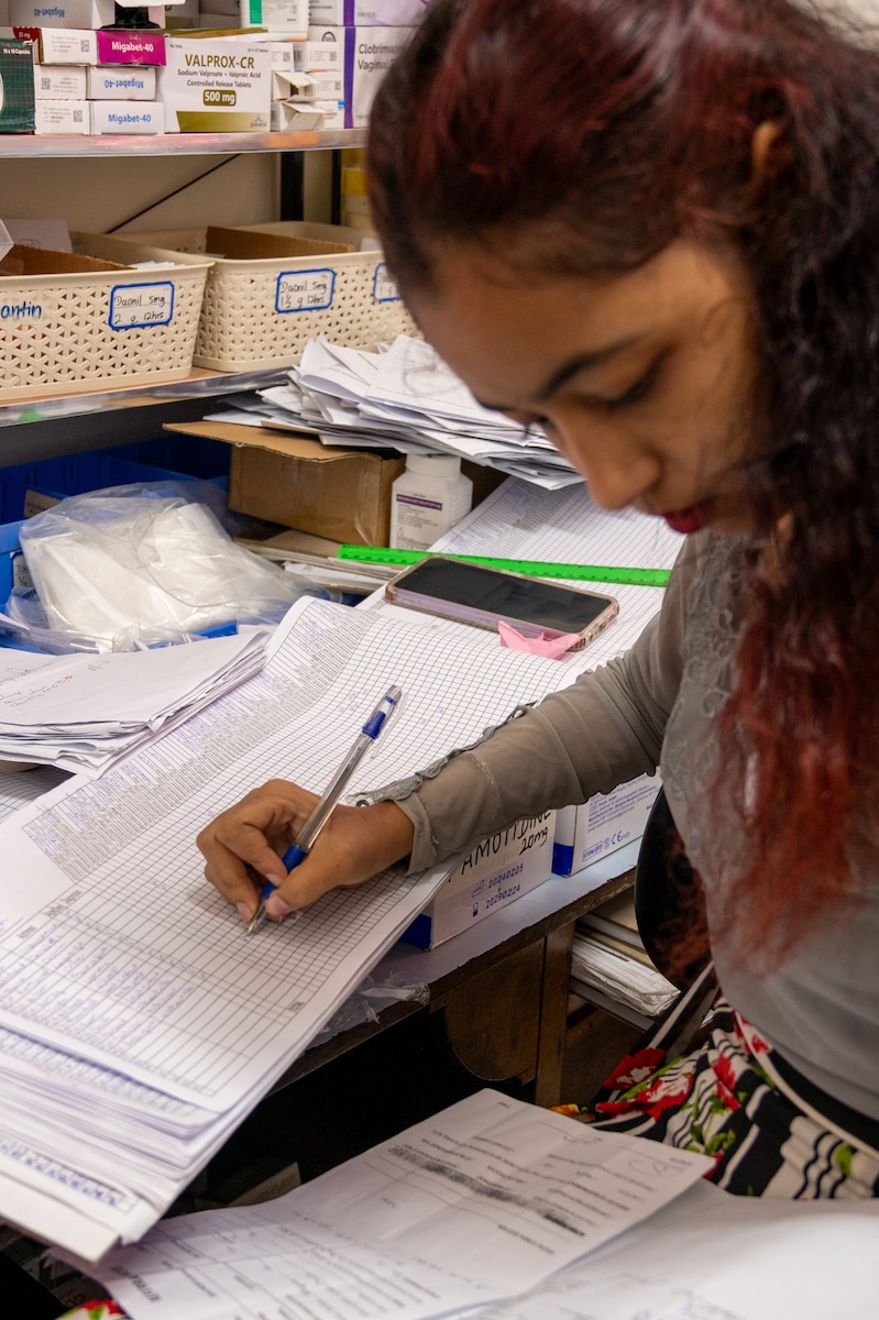 Darshanie Singh, a Guyanese pharmacy technician, updates pharmaceutical records at the West Demerara Regional Hospital outpatient pharmacy in Vreed en Hoop, Guyana, March 20, 2026. As part of the Lesser Antilles Medical Assistance Team (LAMAT) 2026 mission, U.S. Air Force medical professionals worked alongside partner nation medical providers to sharpen clinical readiness and strengthen lasting partnerships in the region. (U.S. Air Force photo by Maj. Stephani Schafer)