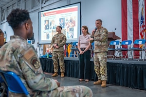 Man Speaks to crowd.